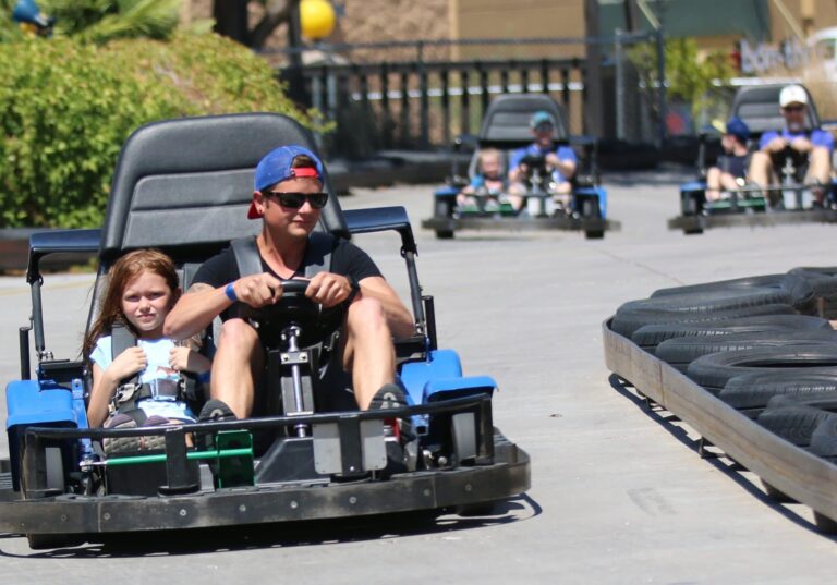 people racing in the go-kart track