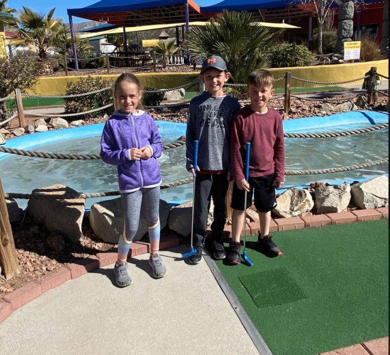 Family Enjoying a game of mini golf