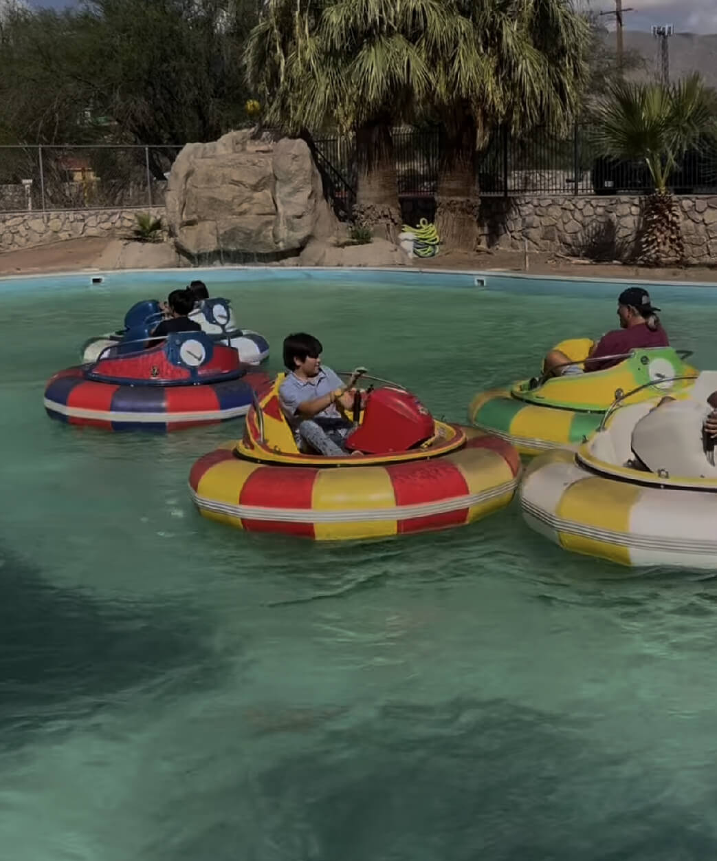 Childrens riding in a colorful bumper boat